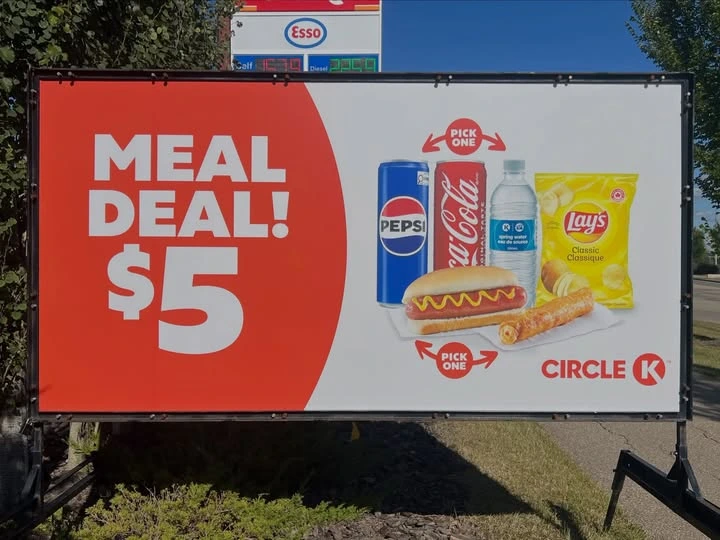 Large portable advertising sign attracting attention from passing drivers