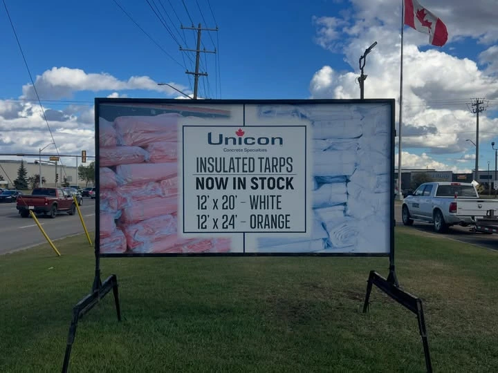 Portable sign displaying a grand opening message for a local business