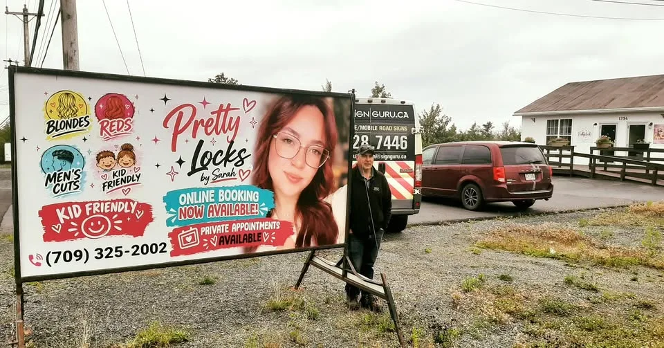 A mobile sign placed at an optimal angle along a busy street for clear driver visibility.